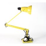 A Herbert Terry & Sons anglepoise lamp painted yellow with makers stamp to base