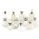 Eleven silver mounted scent bottles,