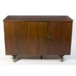 A mid 20th Century sideboard with tray fitted to swing door,