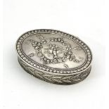 A French oval silver snuff box, 19th Century, the cover decorated birds within a wreath,