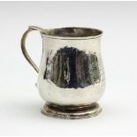 A George III silver mug, Benjamin West, London, ogee shaped on a skirt base, 7cm high,