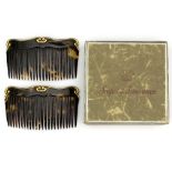 A pair of 9ct gold mounted tortoiseshell hair combs,