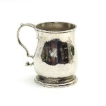 A George II silver mug, Richard Gurney & Thomas Cook, London 1754, ogee shaped on a skirt base,