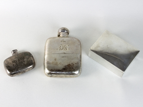 An Edwardian silver hip flask, Birmingham 1908, with pull-off cup and a smaller hip flask,