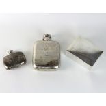 An Edwardian silver hip flask, Birmingham 1908, with pull-off cup and a smaller hip flask,