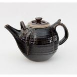 Russell Collins, Hook Norton Pottery/A tenmoku glazed teapot, impressed mark,