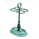 A cast iron umbrella stand with turquoise patination, of four divisions with loop handle,