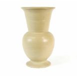 A tall stylised stoneware vase in the style of Keith Murray, with globular ringed body,