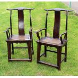 A pair of Chinese yoke back chairs each with concave upright splat and lattice seat,