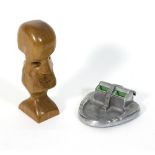 A wooden figural sculpture signed Langton and a Joseph Lucas King of the Road metal ashtray