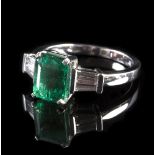 An emerald and diamond dress ring, the emerald approximately 2.