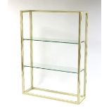 Pierre Vandel (French), a lacquered cream gilt glass shelving/display unit,