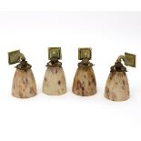 A set of four Art Deco wall lights, the brass scroll mounts with mottled pink glass shades, each 12.