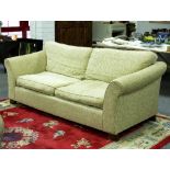 A pair of cream upholstered sofas,