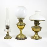 A Victorian brass oil lamp, with opaque white glass shade,
