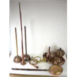 A copper samovar, a small brass watering can, a funnel, two copper clothes plungers, a warming pan,