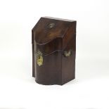 A mahogany knife box of serpentine form with sloping front,
