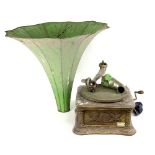 An oak gramophone with applied carving and morning glory horn along with a quantity of needle tins,