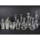 A pair of double lipped cut glass decanters, a pair of tall baluster form decanters,