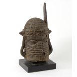 A Benin commemorative head of a dignitary, carved wood with small metal inlays, 36.