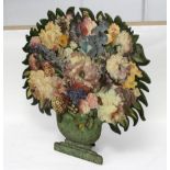 A dummy board fire screen, vase of summer flowers,