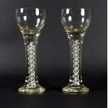 Two 20th Century oversized wine glasses, with opaque twist stems,