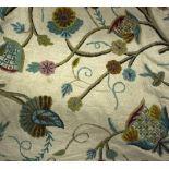 Three crewel work curtains and a pelmet