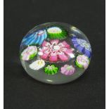 A Clichy miniature glass paperweight with spaced millefiori decoration, 4.