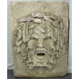 A carved stone Green Man fountain head,