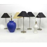 Six chrome table lights with shades and two vase shaped table lights with shades