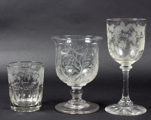 A group of three drinking glasses with engraved initials comprising 'EH' and vines,