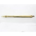 A gold telescopic pencil by S Mordan & Co., with green hardstone seal to end, stamped S Mordan & Co.