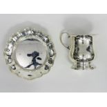 A silver ogee shaped mug, Birmingham 1926, and a circular dish,