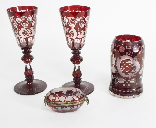 A group of Bohemian clear and ruby flash glass comprising a pair of goblets,