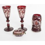 A group of Bohemian clear and ruby flash glass comprising a pair of goblets,
