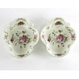 A pair of 19th Century enamelled pearlware shell shaped dishes, painted floral decoration,