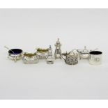 A pierced oval silver mustard pot, Birmingham 1901, another, two pepper pots, a circular salt,