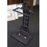 A cast iron umbrella stand, the pierced back with leaf decoration,