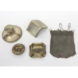 A silver chain mail bag, the handles marked Sterling, two silver ash trays, a capstan inkwell etc.