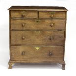 A Georgian oak chest of three long and two short drawers, on bracket feet,