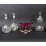 A suite of glassware engraved fruiting vines, comprising a pair of shaft and globe decanters,