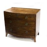 A Regency mahogany bowfront chest of three drawers on splay feet,