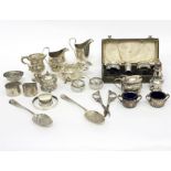 A quantity of silver, including a George III jug, a pair of berry spoons,