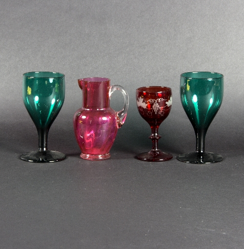 A pair of green glass goblets, 13cm high,