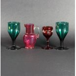 A pair of green glass goblets, 13cm high,