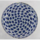 An 18th Century Delft blue and white dish, decorated repeating leaf motif,