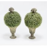 A pair of OKA urns with faux thyme plants,