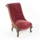 A Victorian nursing chair with scroll back,