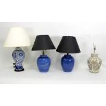 A pair of blue vase shaped table lights and two others