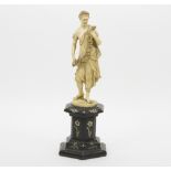 A 19th Century Continental ivory figure of a Classical lady holding a wreath,